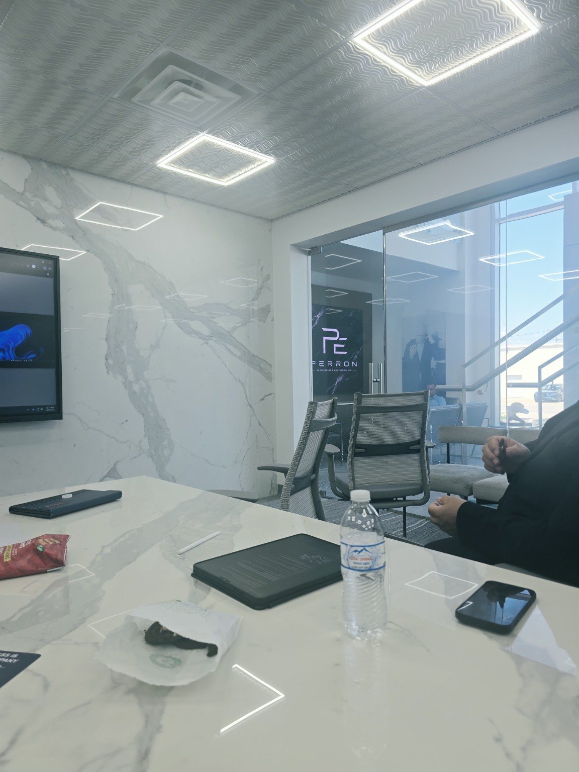 LRC conference room with the lobby and VUE video display visible through the glass wall